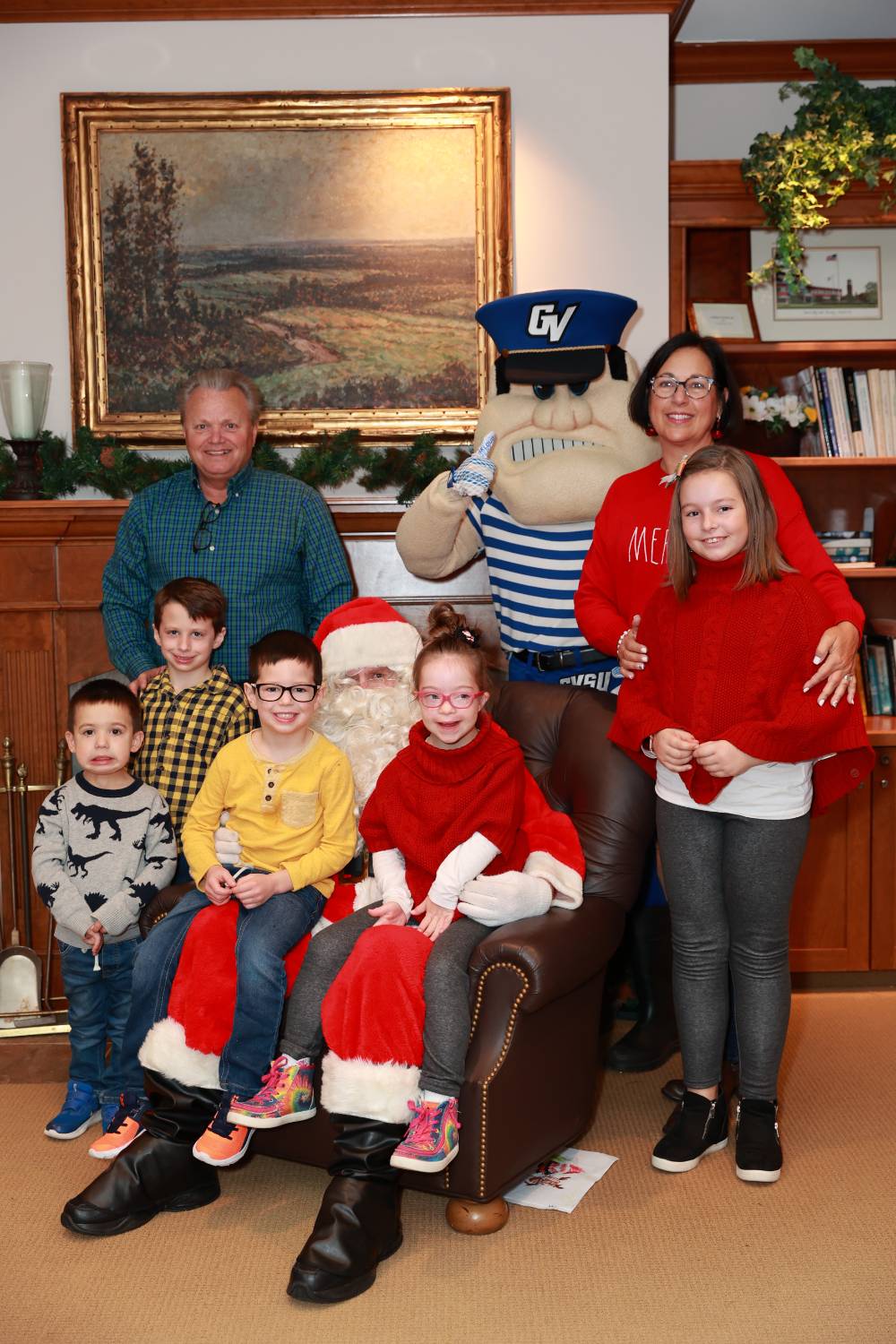 A family of six at the Holiday Brunch with Santa & Louie.